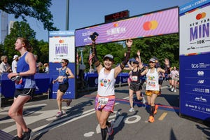 crossing the finish line at the new york mini 10k race