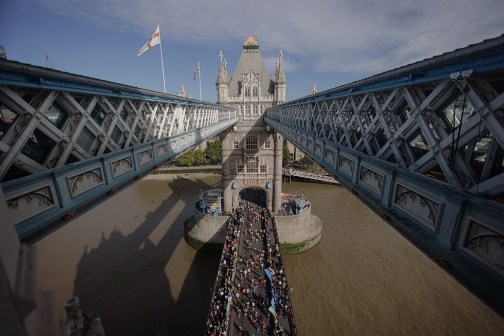 view of london marathon runners from tower bridge