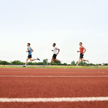 runners training on running track