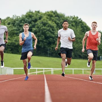 runners training on running track