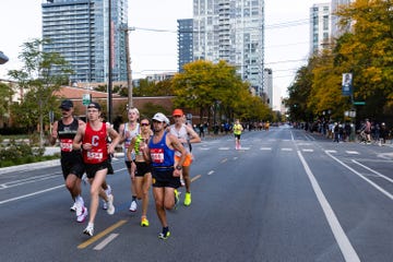 Runners participating in a marathon event on an urban street