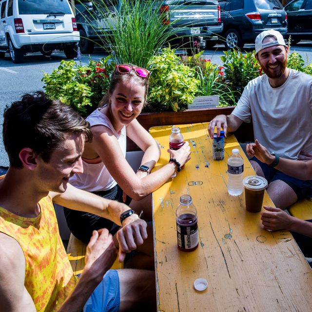 four runners sitting at a table after a run