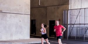 two runners in a parking garage