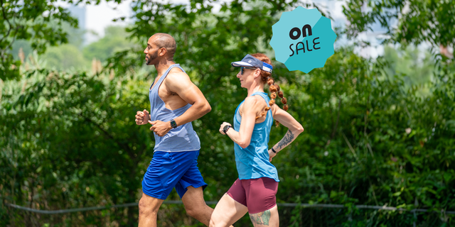 a man and woman in running apparel running together