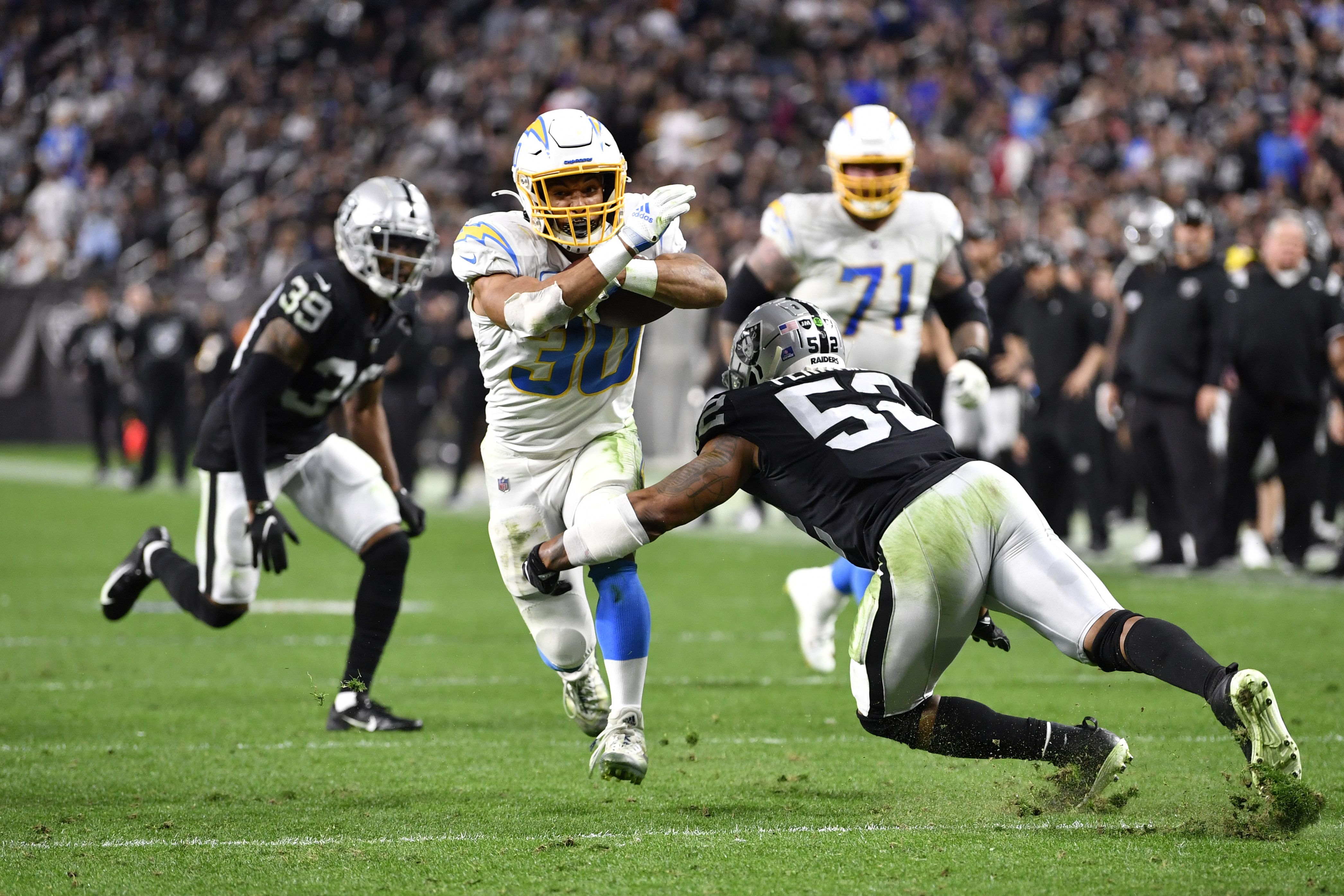 Los Angeles Chargers running back Austin Ekeler (30) walks on the field  before an NFL football game against the Kansas City Chiefs Thursday, Dec.  16, 2021, in Inglewood, Calif. (AP Photo/Kyusung Gong