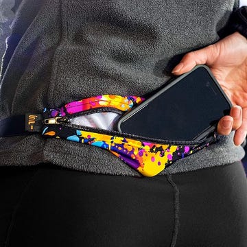 a person putting a cell phone into a running belt