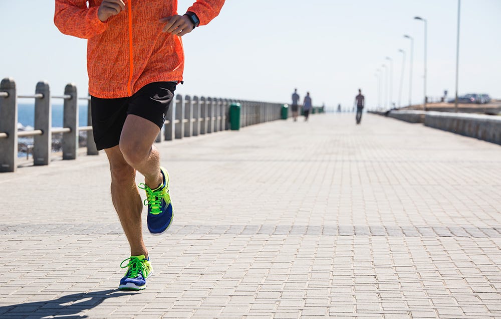 close up of guy's legs while running 