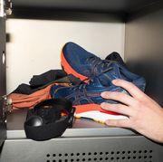 running shoes, fitness tracker, shirt in locker