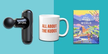 massage tool coffee mug and travel guide on a turquoise background