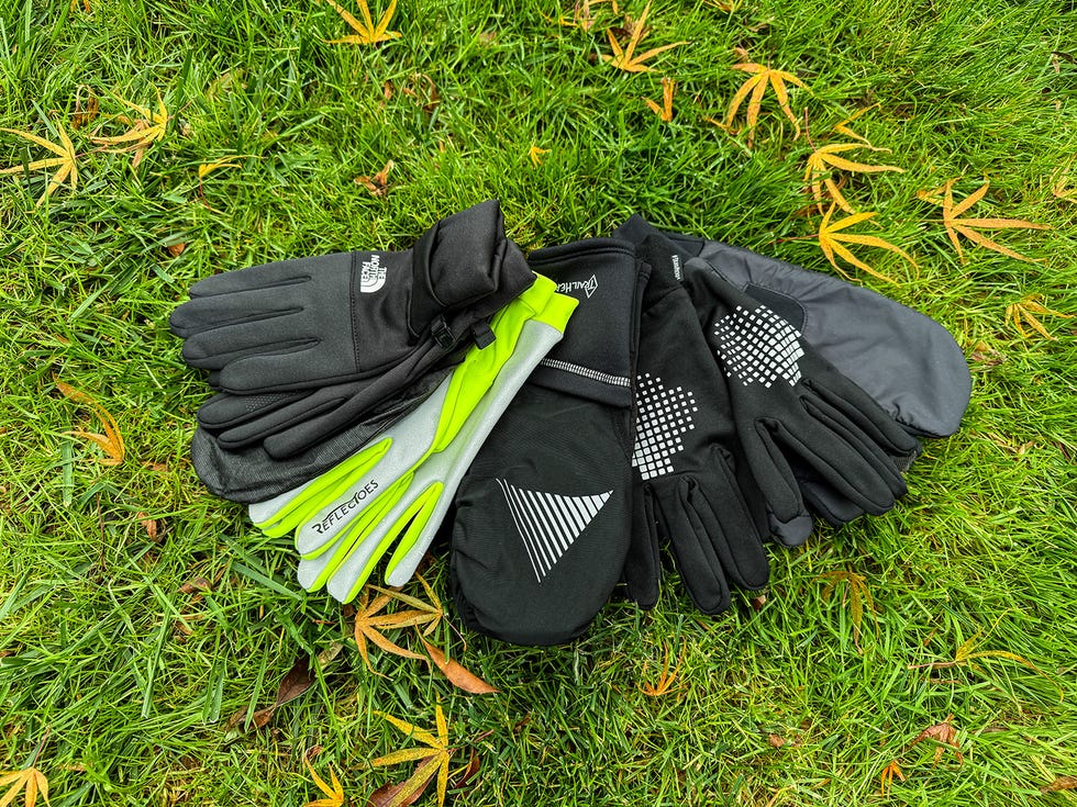 a group of winter running gloves on grass