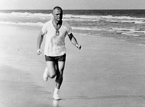 mercury 7 astronaut john glenn runs on the beach