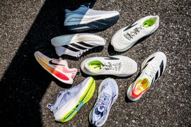 different running shoes on a concrete surface