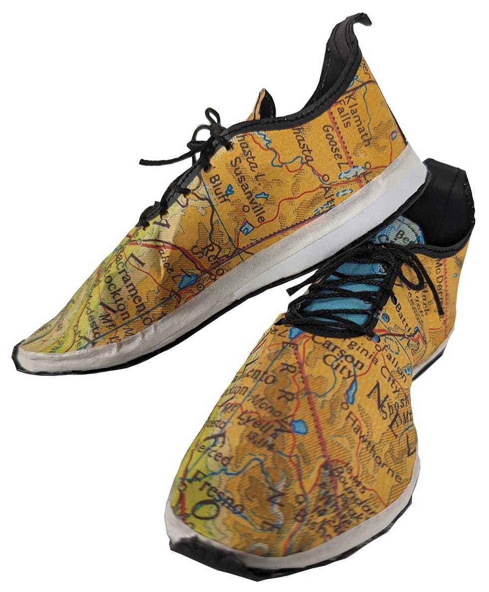 running shoes, map, cities, sculpture