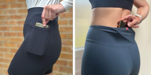 two people reaching into their shorts for a smartphone