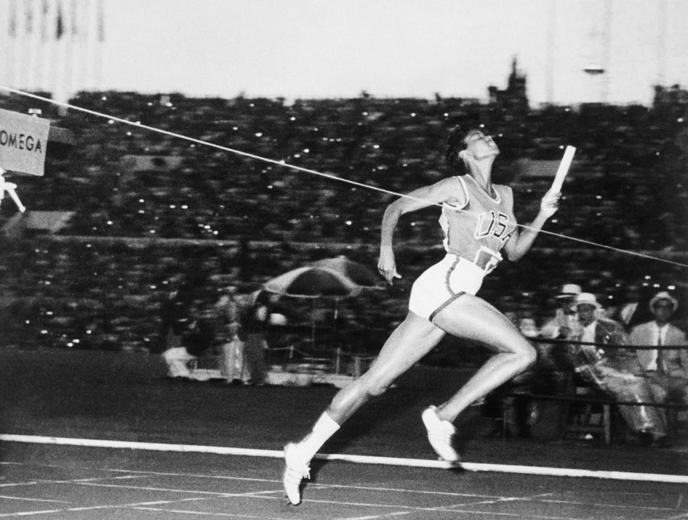 wilma rudolph crossing the finish line in relay