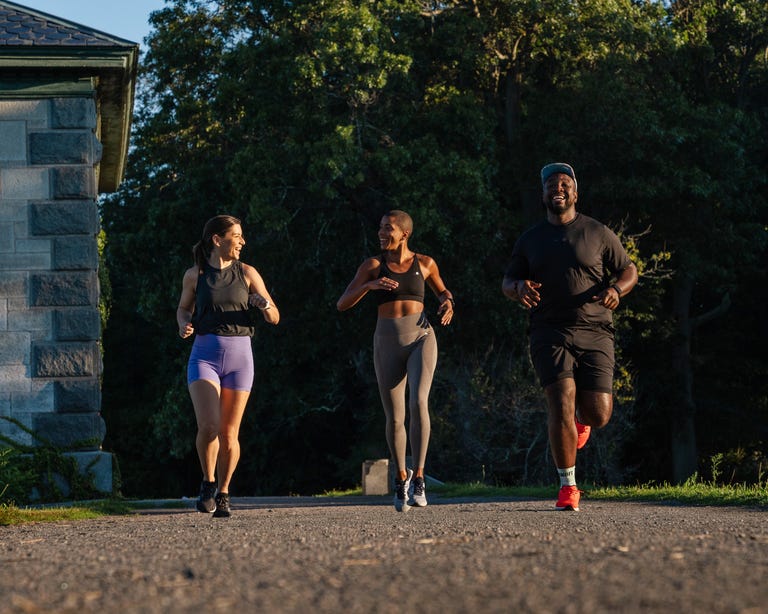 three runners on gravel path