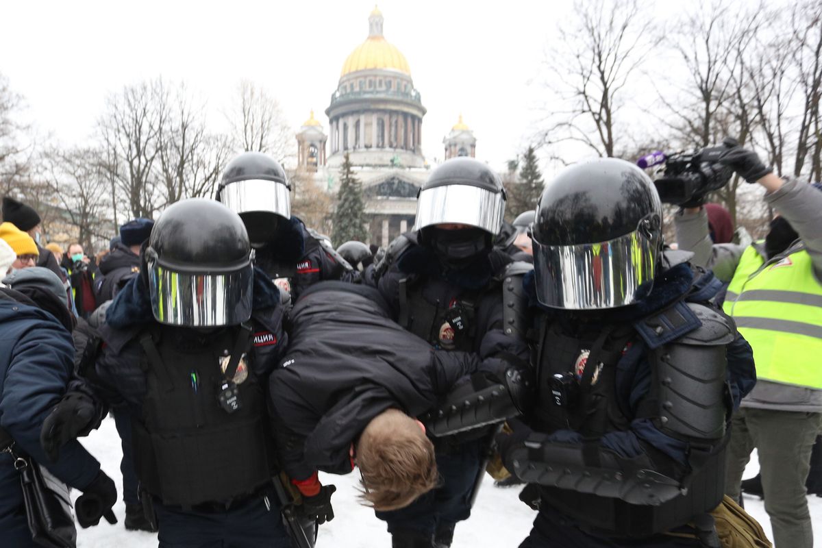 police officers detain a protester during a rally in support of alexei navalny politica in st petersburg, russia, on january 23, 2021 opposition politician alexei navalny has returned after poisoning from germany to russia and was detained at the airport in moscow  photo by valya egorshinnurphoto via getty images