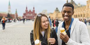 Russia, Moscow, couple eating icecream in the city