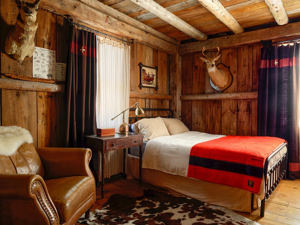 a 1819 barn home in maine with a woodsy bedroom