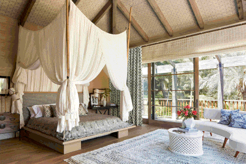 rustic bedroom with canopy bed