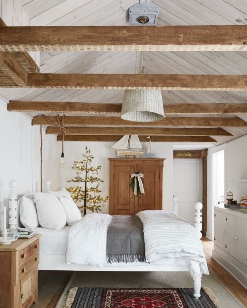 rustic bedroom with pine beams and pine furniture