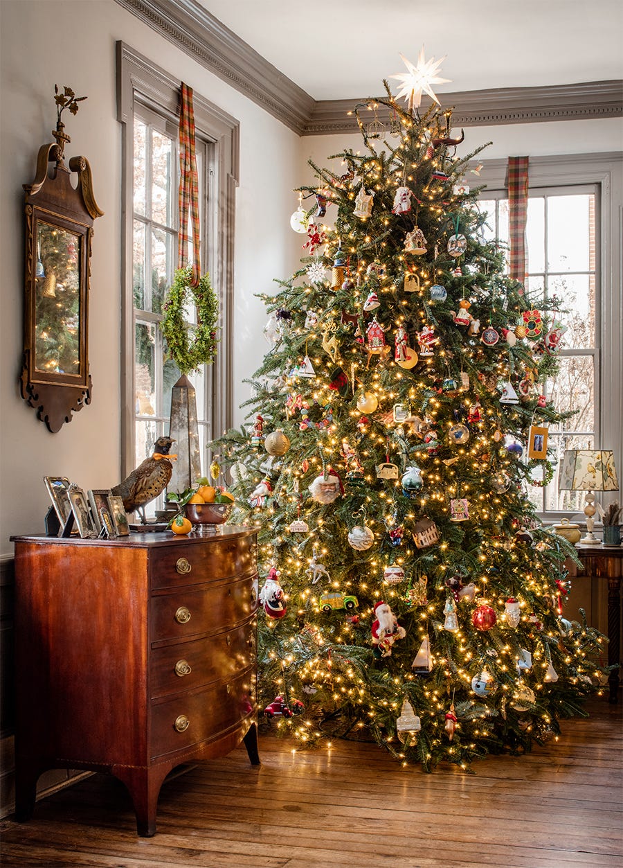 christmas tree in classic living room decorate with lots of ornaments and lights