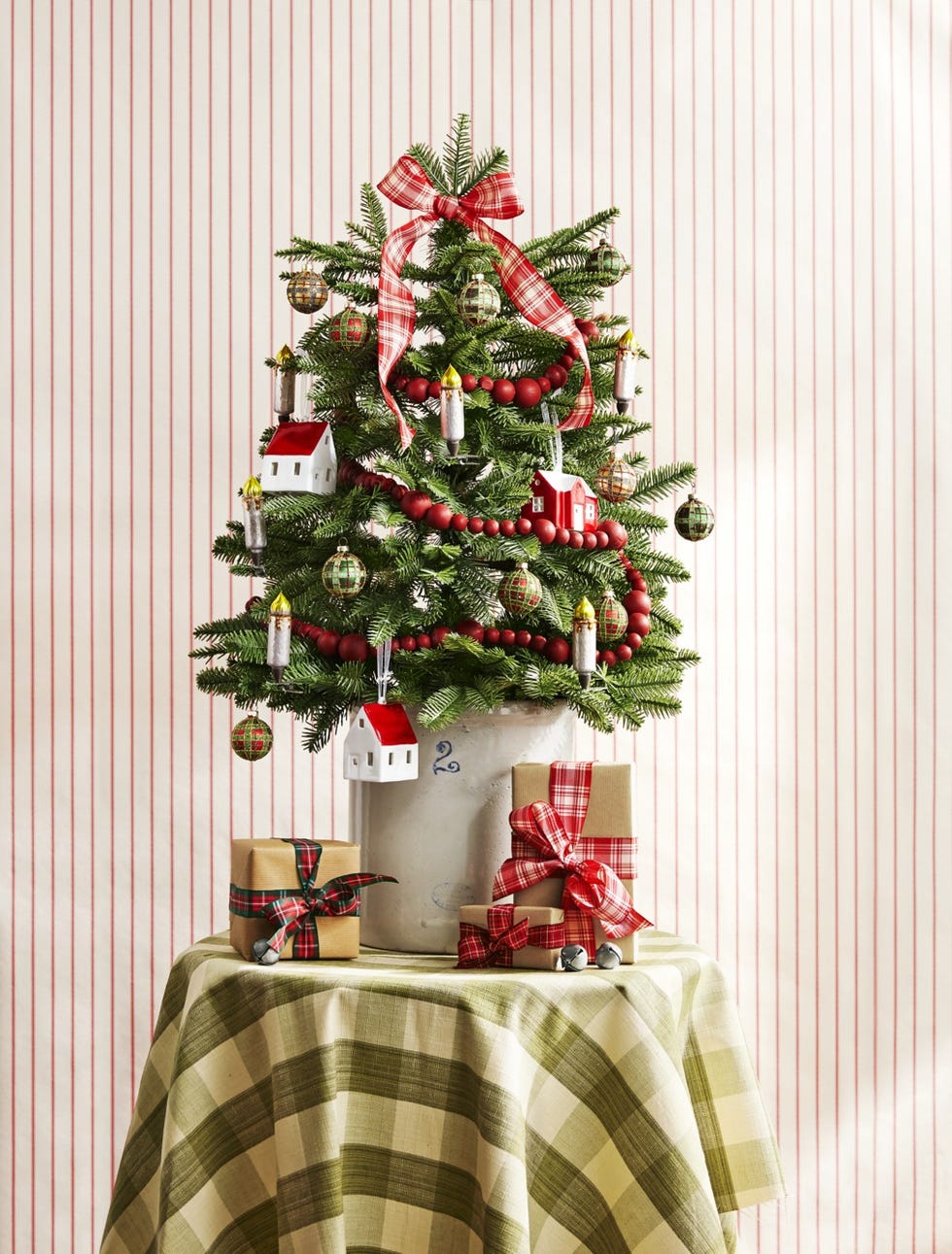 small tree in crock on table with green gingham tablecloth