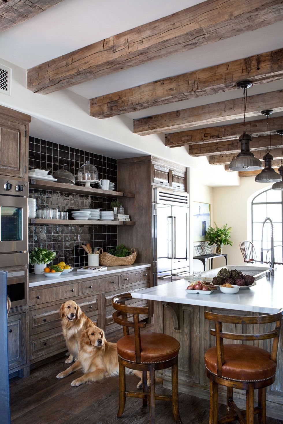 https://hips.hearstapps.com/hmg-prod/images/rustic-kitchen-dogs-1517251288.jpg?crop=0.943xw:0.944xh;0,0&resize=980:*