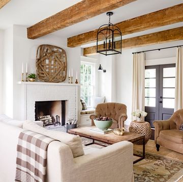 a creamy white living room with layers of brown