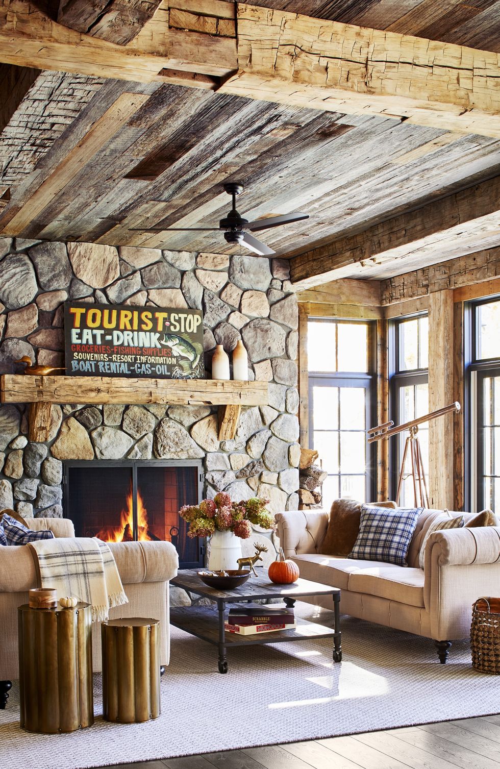 https://hips.hearstapps.com/hmg-prod/images/rustic-living-room-stone-fireplace-wood-beams-1569464905.jpg?crop=0.951xw:0.975xh;0.0187xw,0.00114xh&resize=980:*