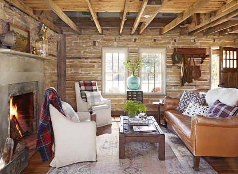 rustic-living-room-stone-walls-wood-rafters