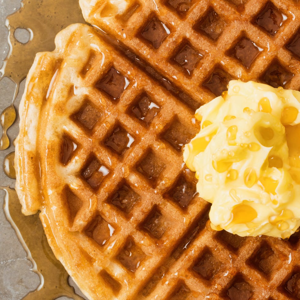 rustic traditional waffle with butter and maple syrup