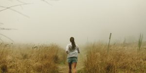 a woman runs without worrying about metrics or her weight