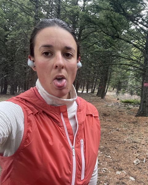 maggie slepian taking a break during a trail run while wearing a running vest