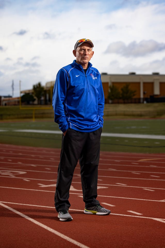 moore high school track and field coach stefan seifried poses for portraits at the school track nov 10, 2021 in moore, oklahoma