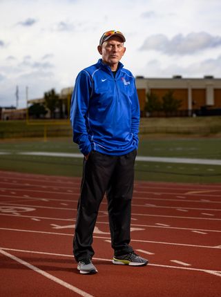 moore high school track and field coach stefan seifried poses for portraits at the school track nov 10, 2021 in moore, oklahoma