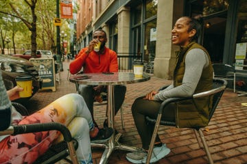 three runners drinking coffee after a run