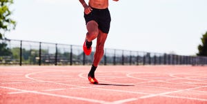 man running from on a track with a heart rate monitor