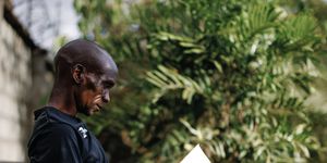 eliud kipchoge takes a quiet moment at home in elodoret, kenya, to read a book