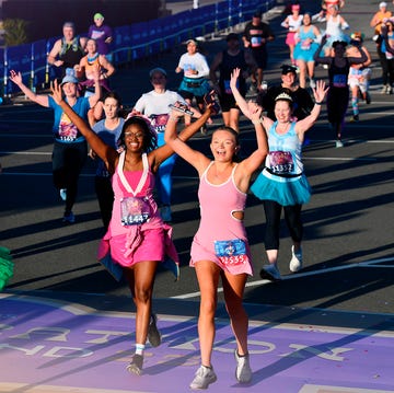 runners celebrating close to the finish line at the 2025 disney princess half marathon runners celebrating close to the finish line at the 2025 disney princess half marathon