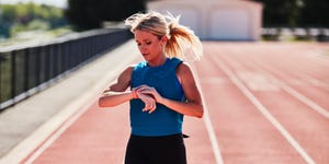 a woman running on a track