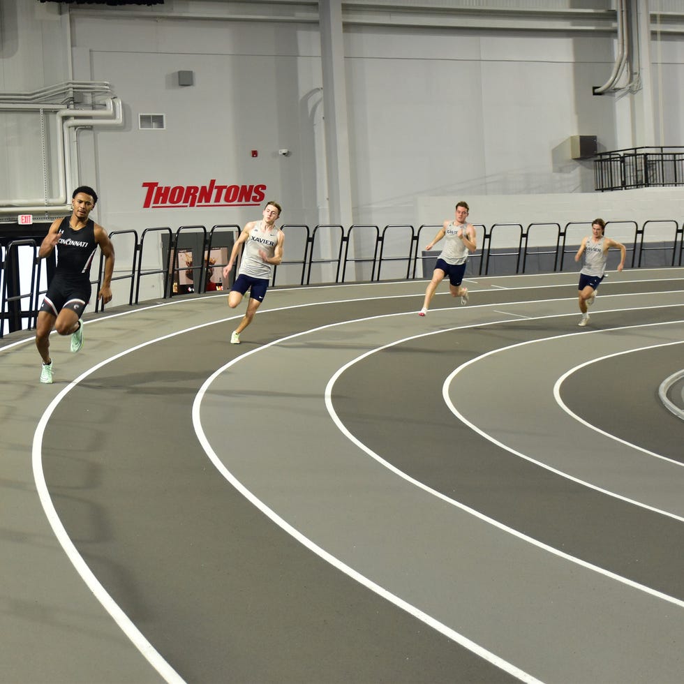 a group of people running on a track
