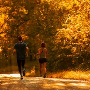 man and woman running outside