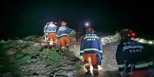 rescuers search