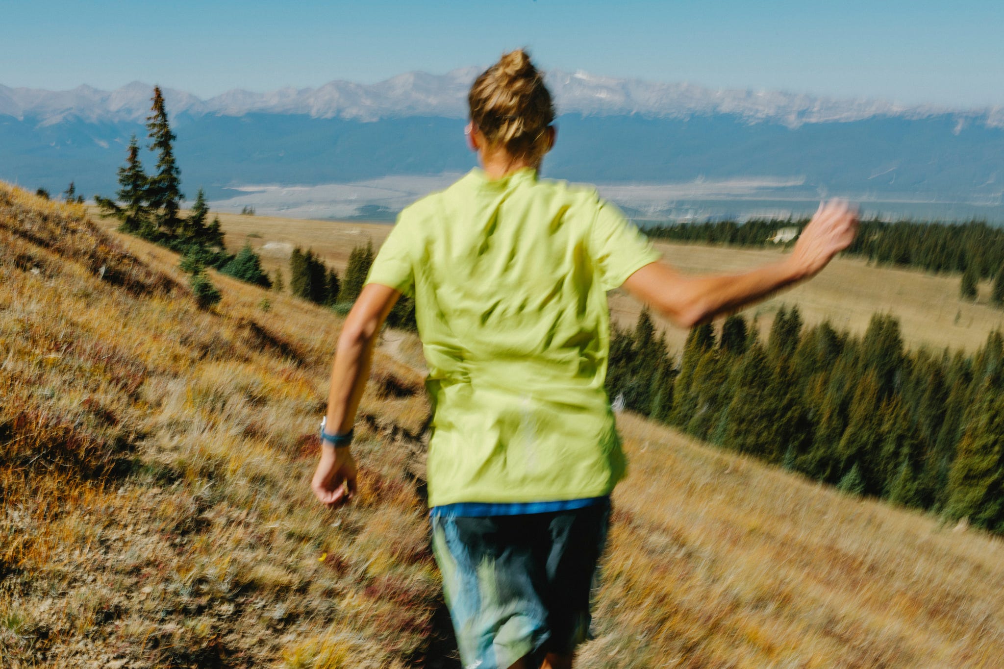 a runner on a mountainous trail