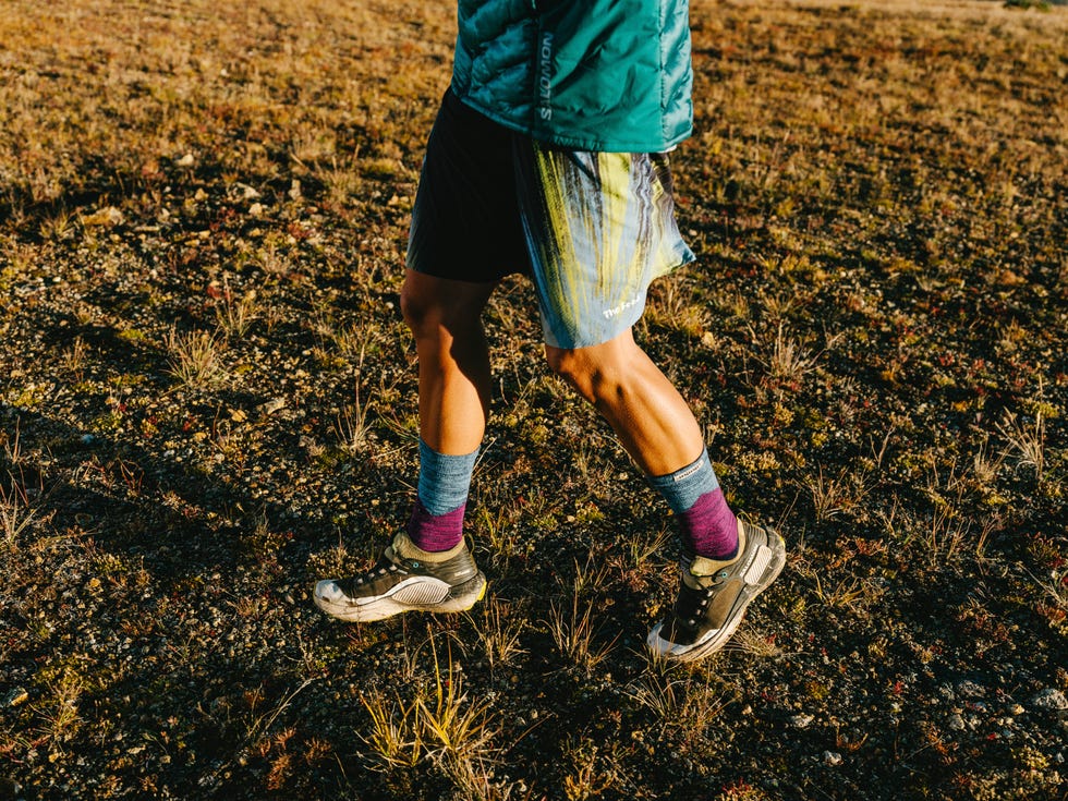 a runner on a mountainous trail