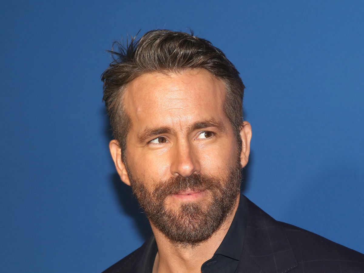 https://hips.hearstapps.com/hmg-prod/images/ryan-reynolds-poses-at-the-opening-night-of-the-music-man-news-photo-1645546356.jpg?crop=1xw:0.64666xh;center,top&resize=1200:*