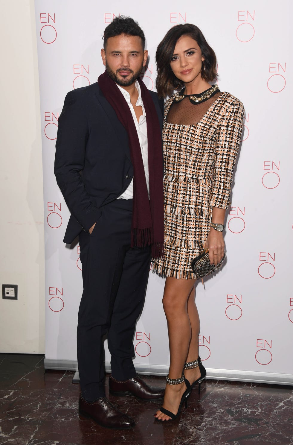 ex coronation street actor ryan thomas poses with his partner lucy mecklenburgh in front of white background
