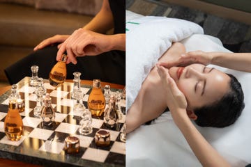 a woman lying on a bed with a chess board and a chess board