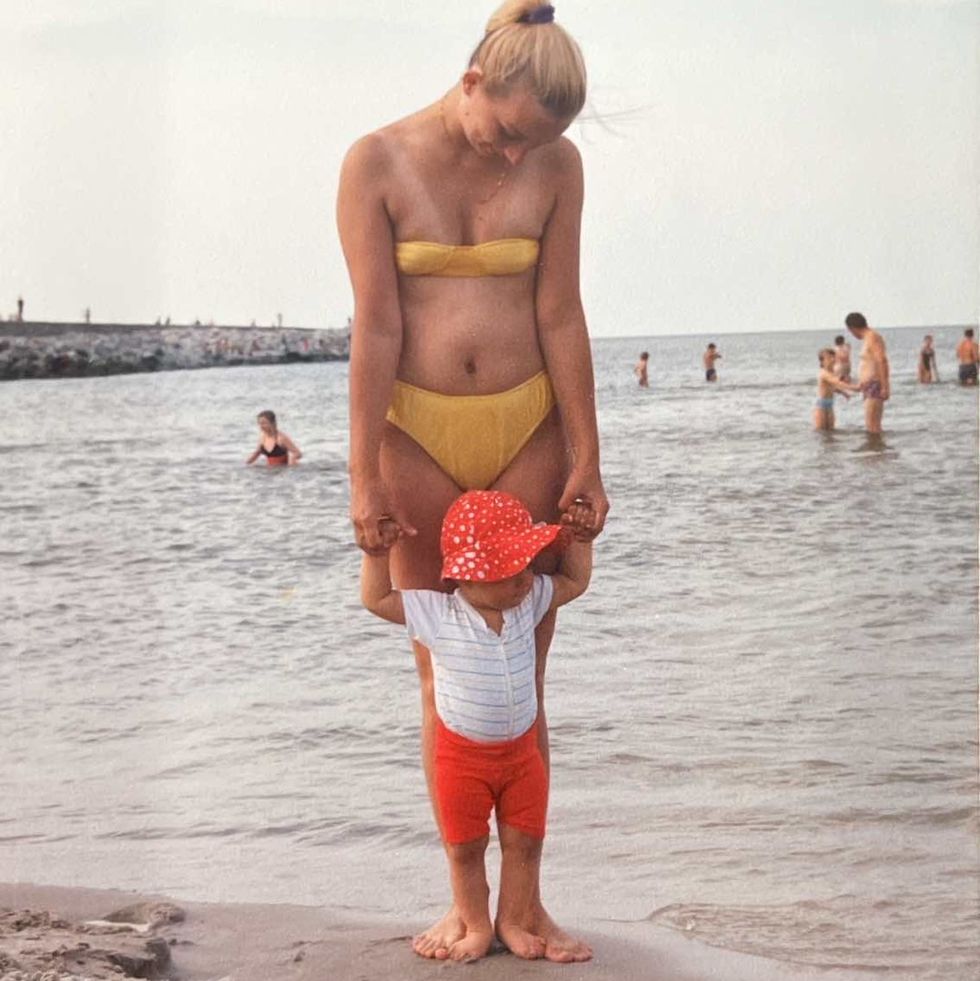 a person and a child on a beach